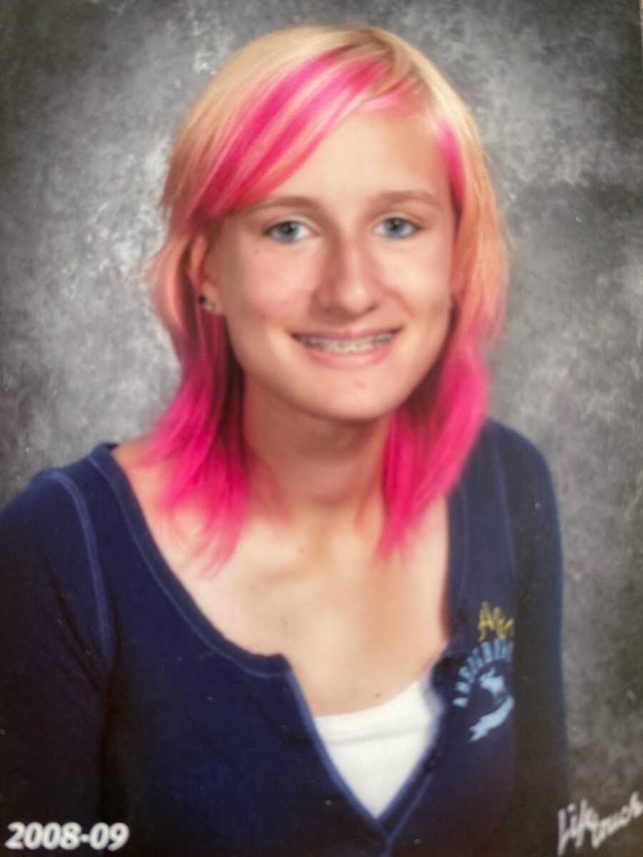 School photo of a 9th grader with pink streaks