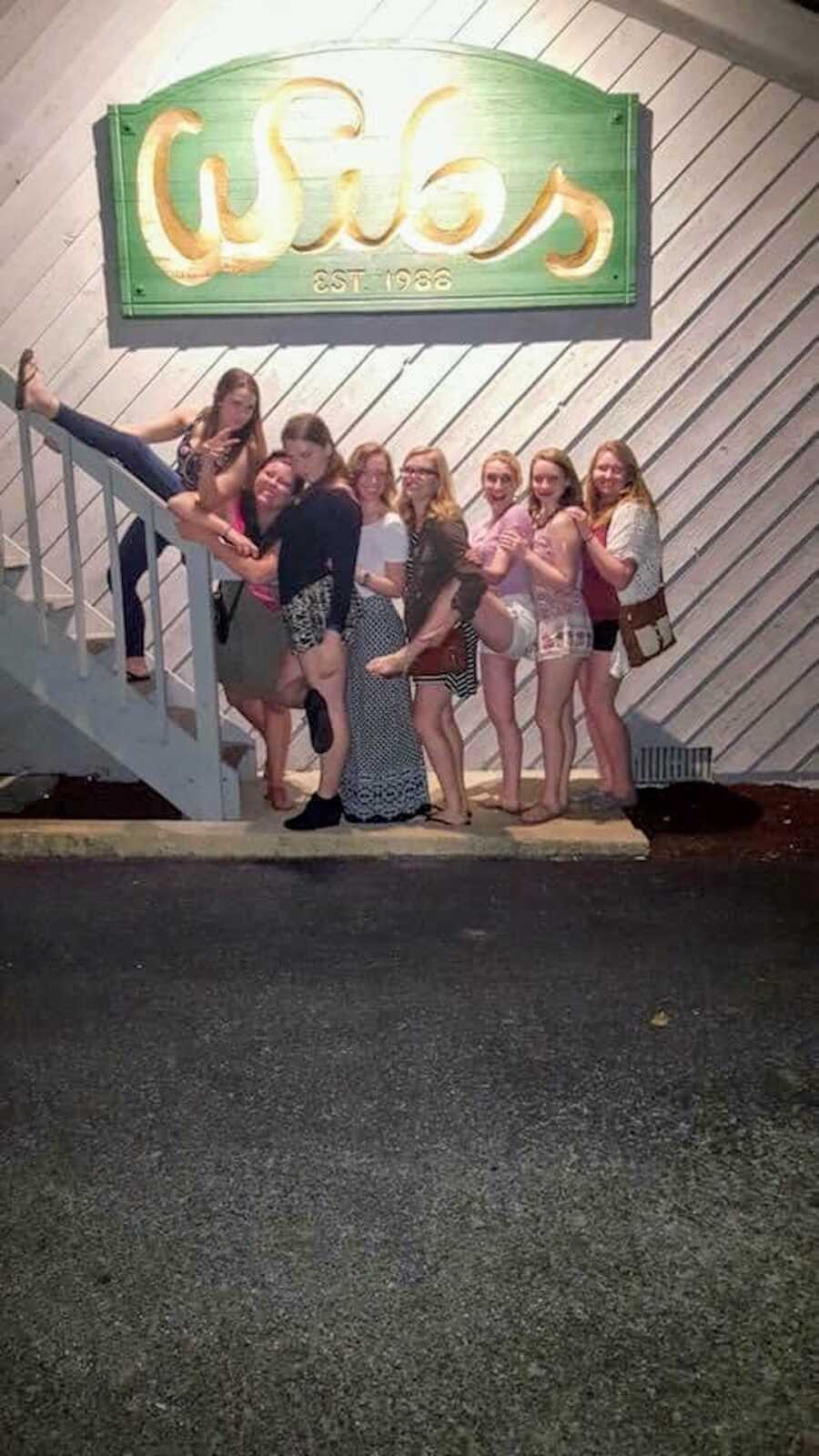 Group of college girls posing together in a line