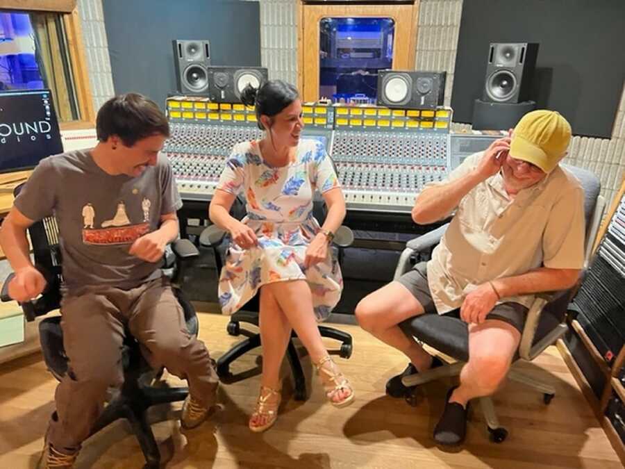 men and a woman in recording studio