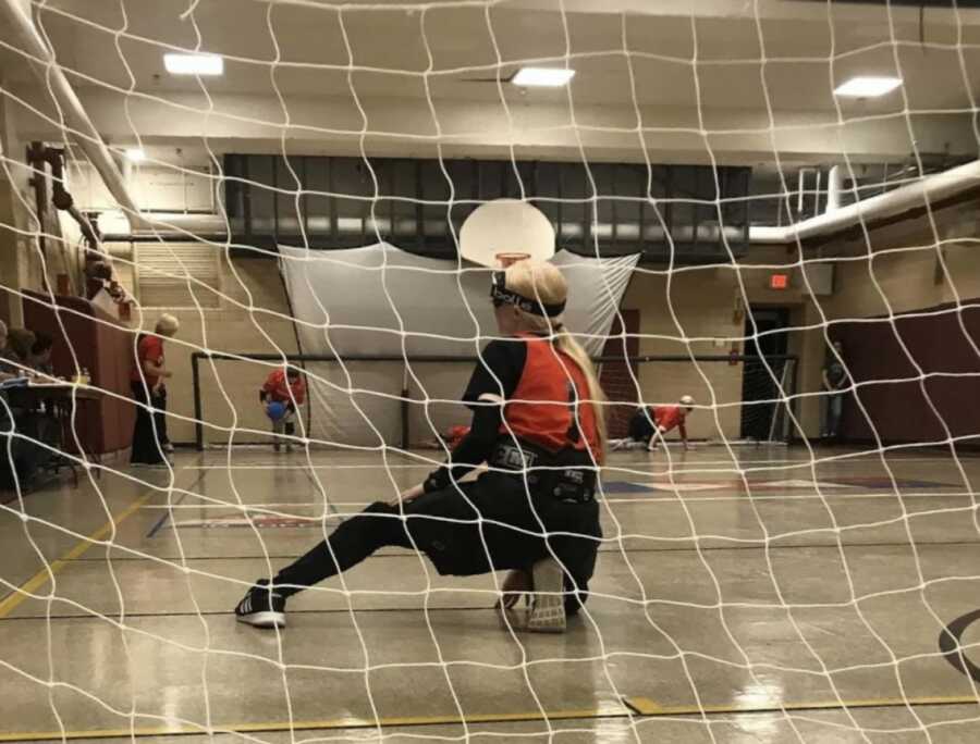 albino person playing soccer designed for blind people