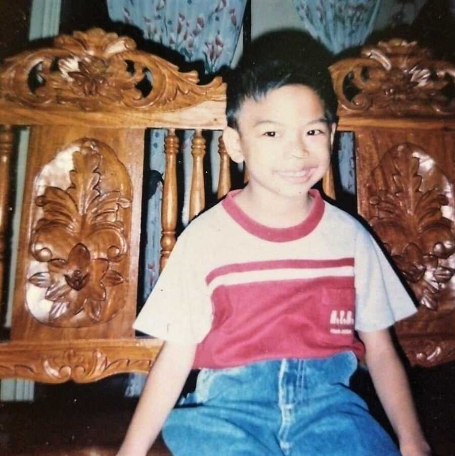 cerebral palsy boy posing on a chair