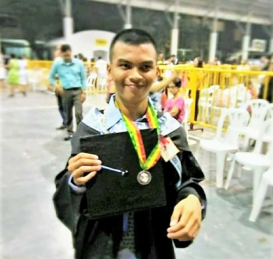 man with cerebral palsy at graduation