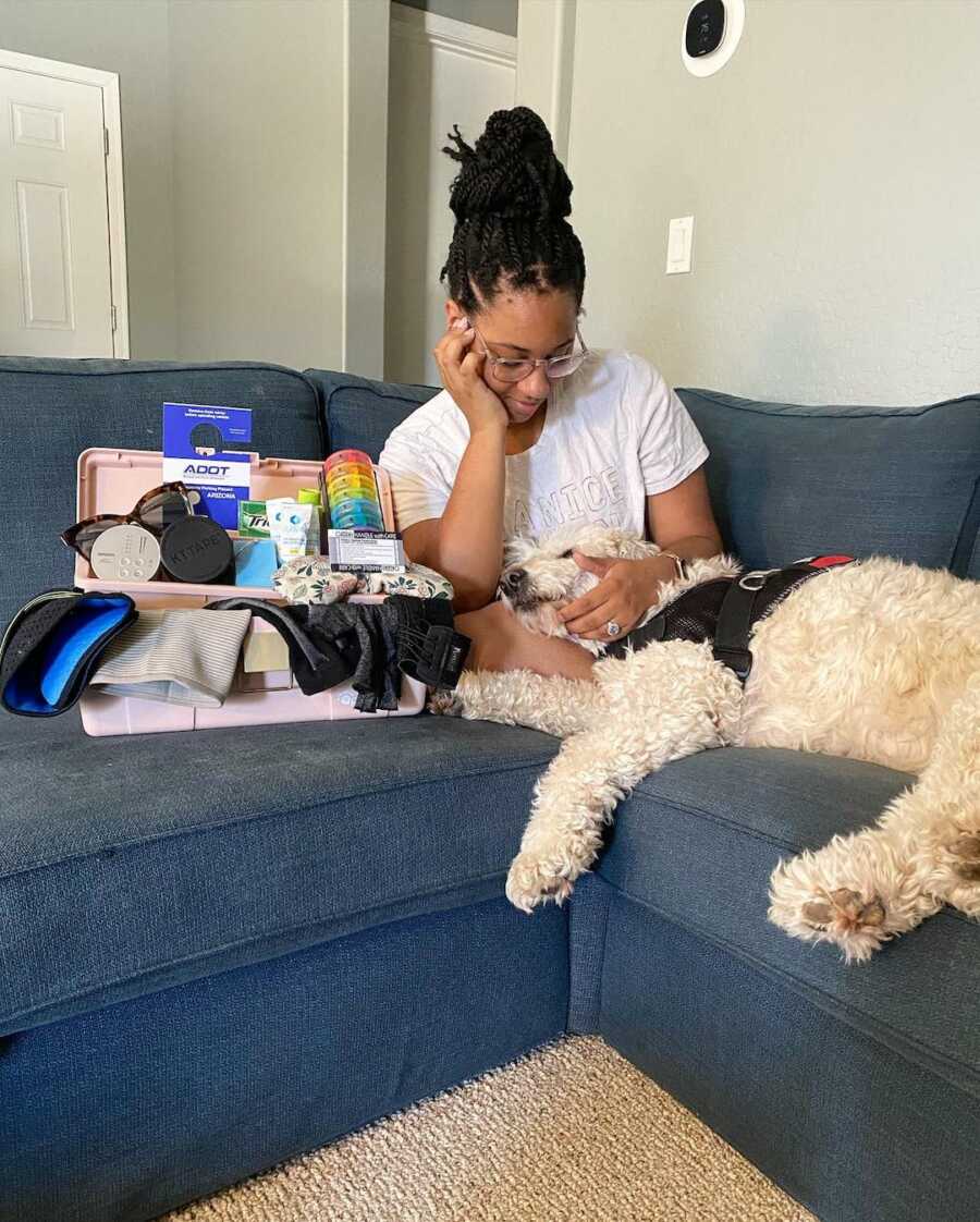 woman and her service dog on the couch