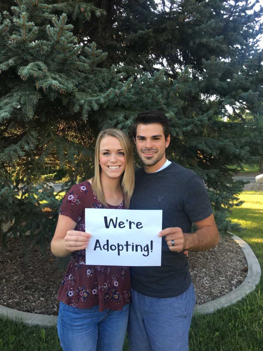 woman and man with sign 