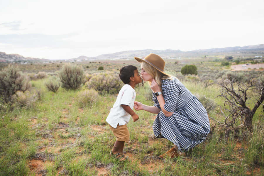 woman kissing baby