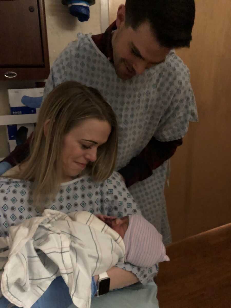 mother and father at hospital with newborn 