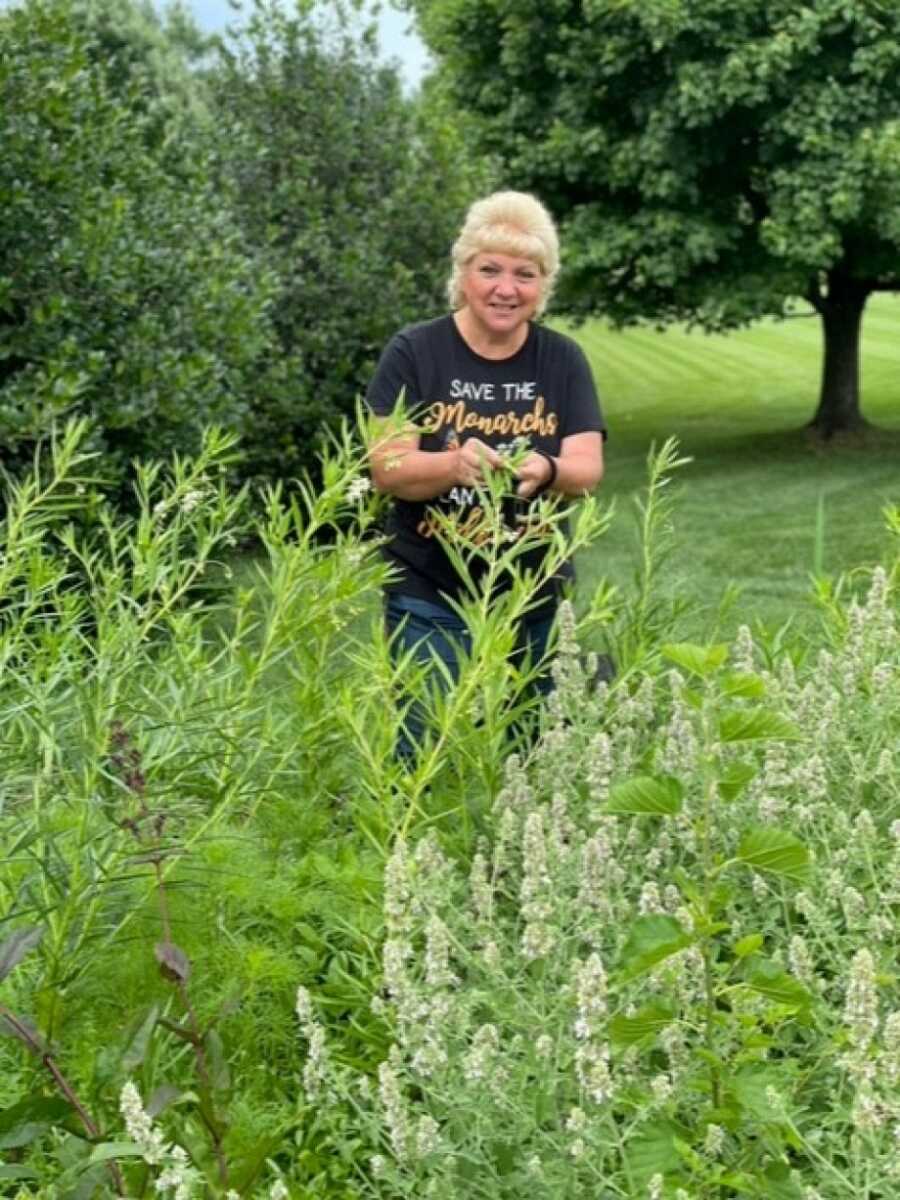 woman showing off her plants