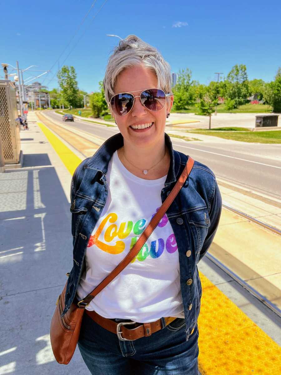 Gay woman wearing a pride shirt