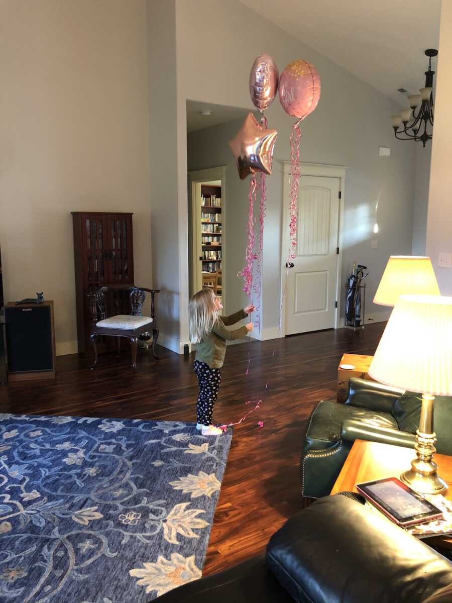 first daughter with balloons