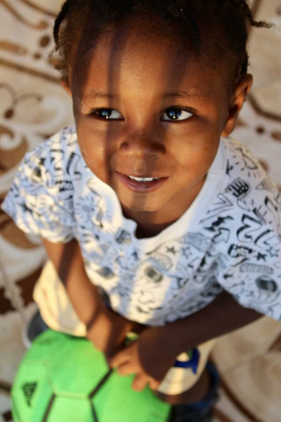 boy found in dumpster smiling at dad