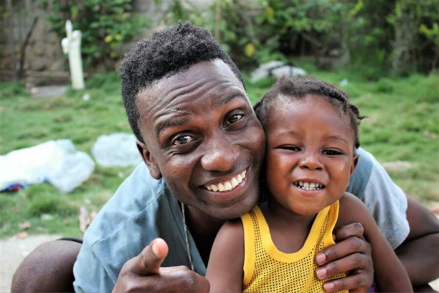 dad and son smiling together