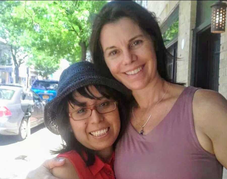 Woman and adopted mother smiling