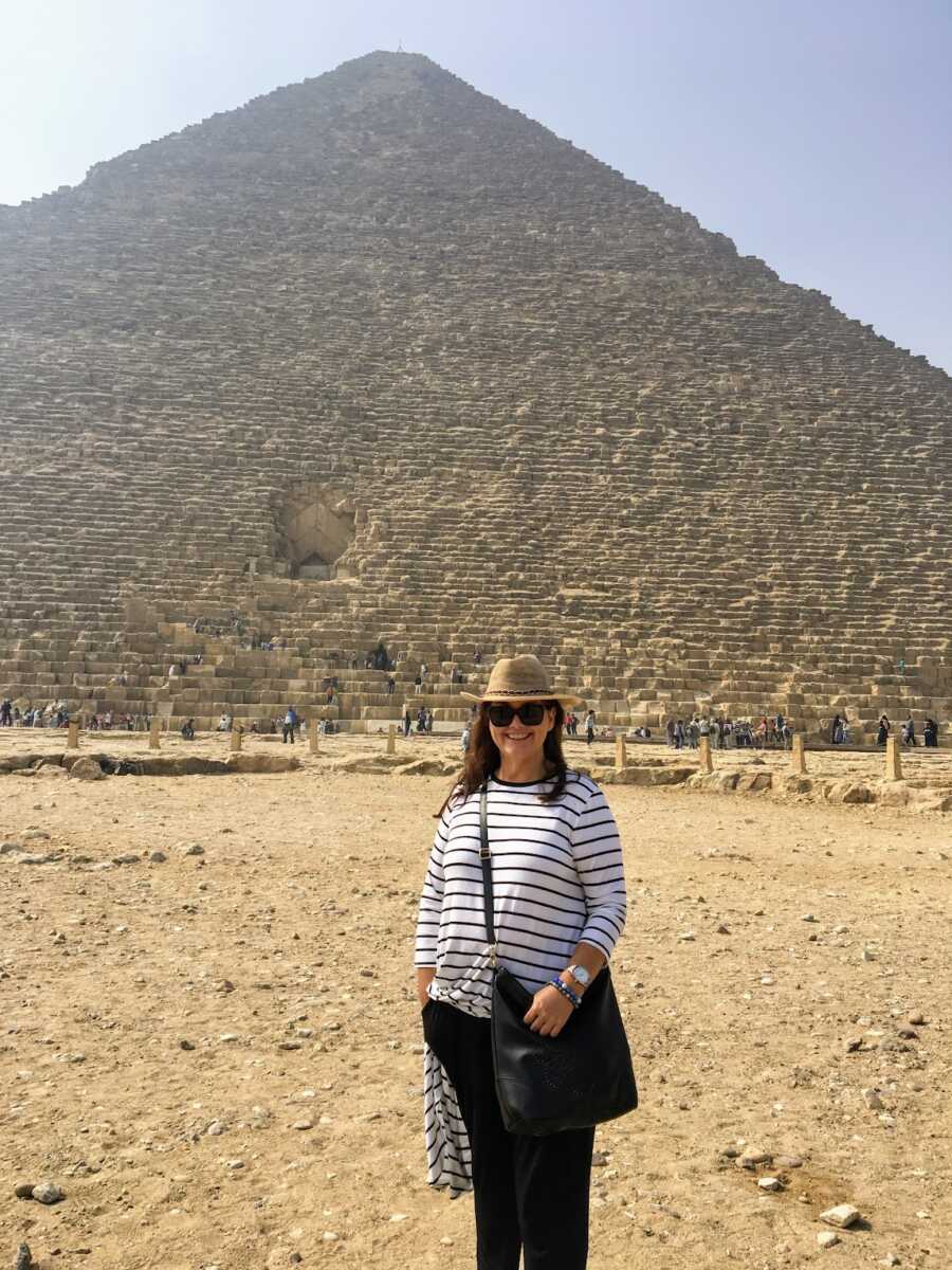 childhood sexual assault survivor in front of pyramid