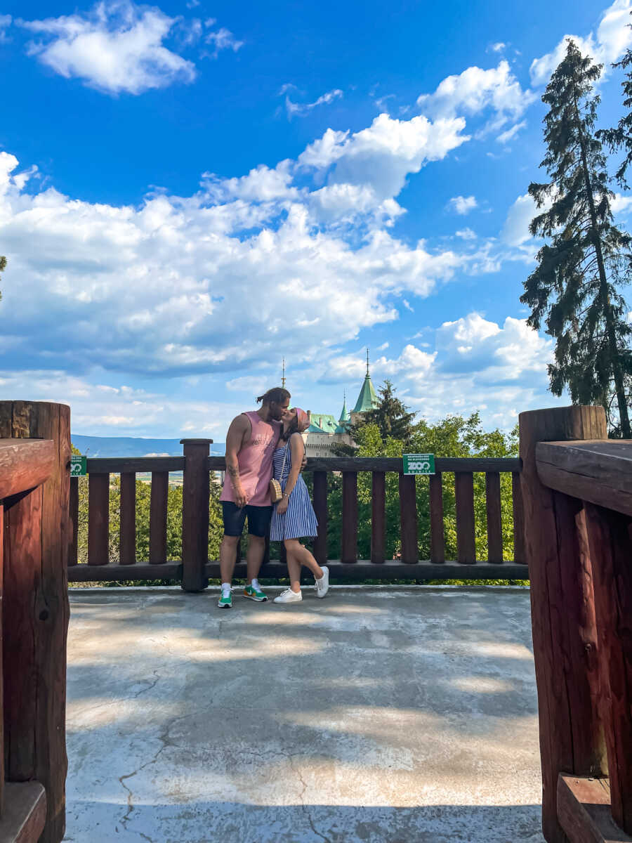 couple kissing with a beautiful view