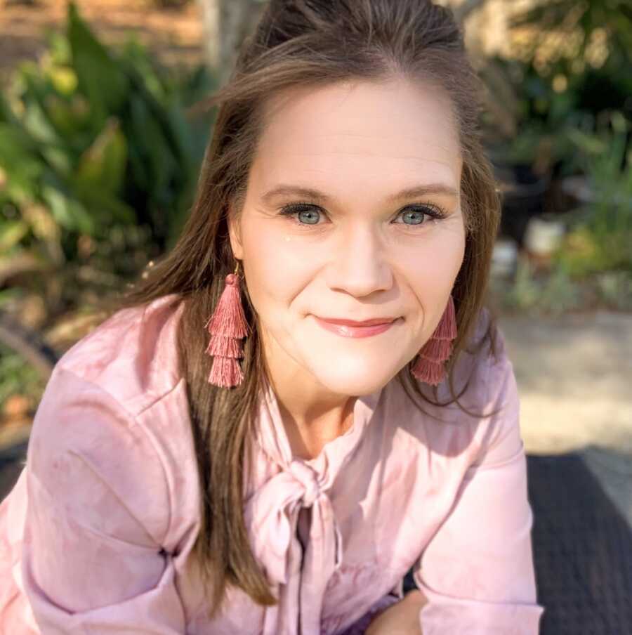 chronically ill woman smiling at camera