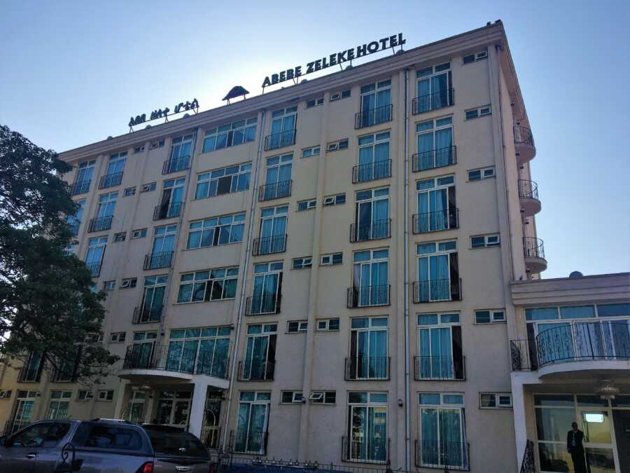 Image of the exterior of the Abebe Zeleke Hotel in Ethiopia from across the street