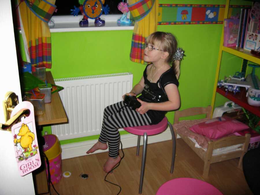 little girl playing video games