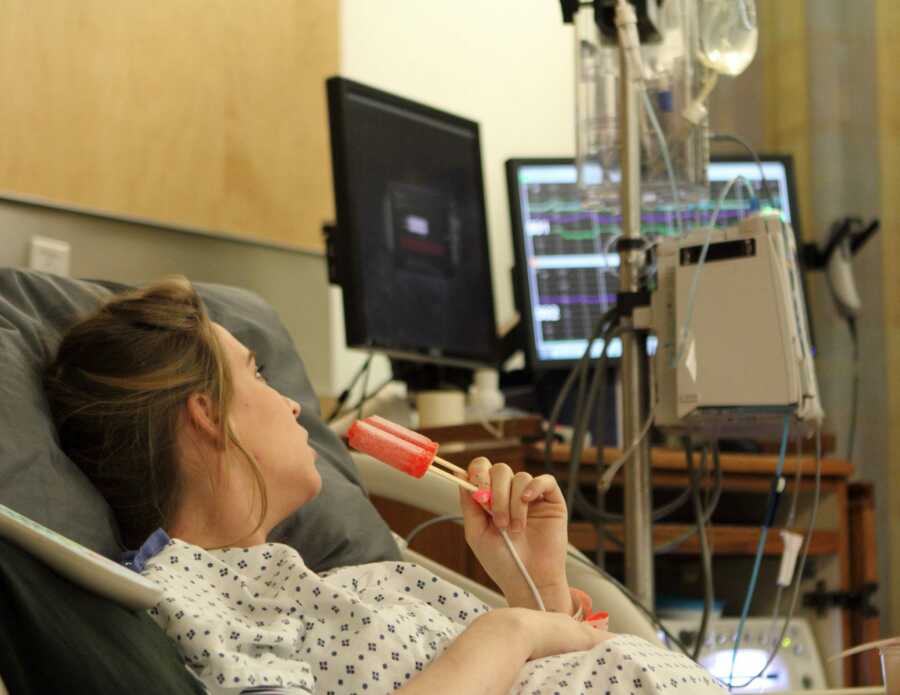 mom eating a popsicle in the hospital