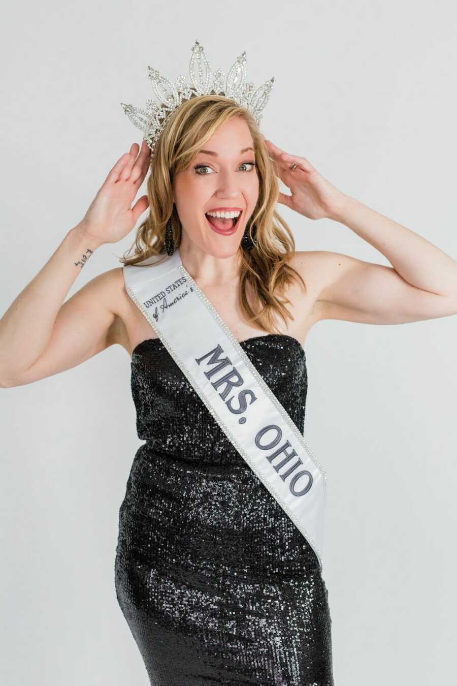 woman in Mrs. Ohio sash and dress