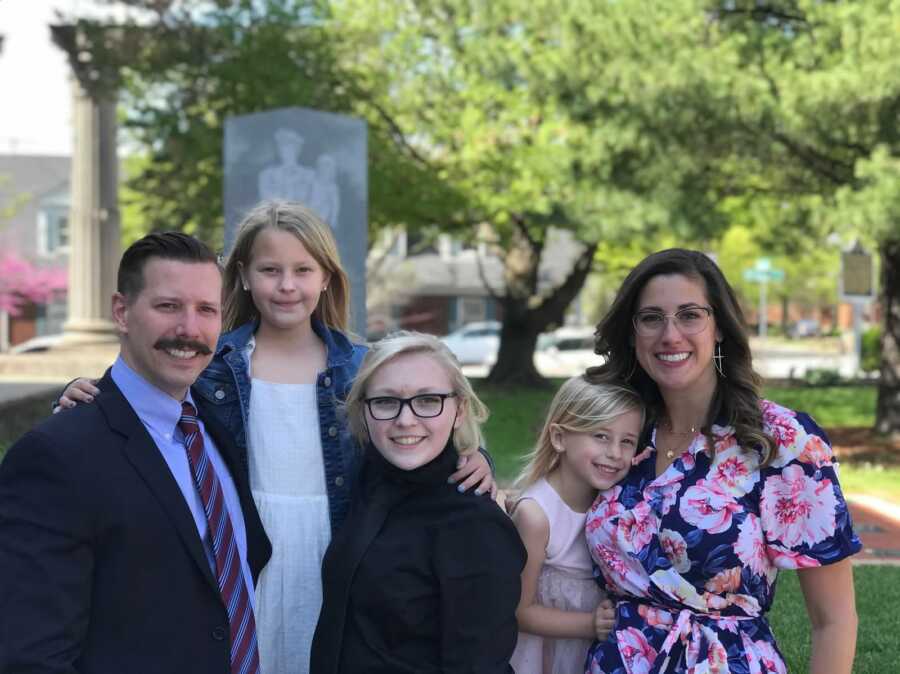 Family outside together following adoption