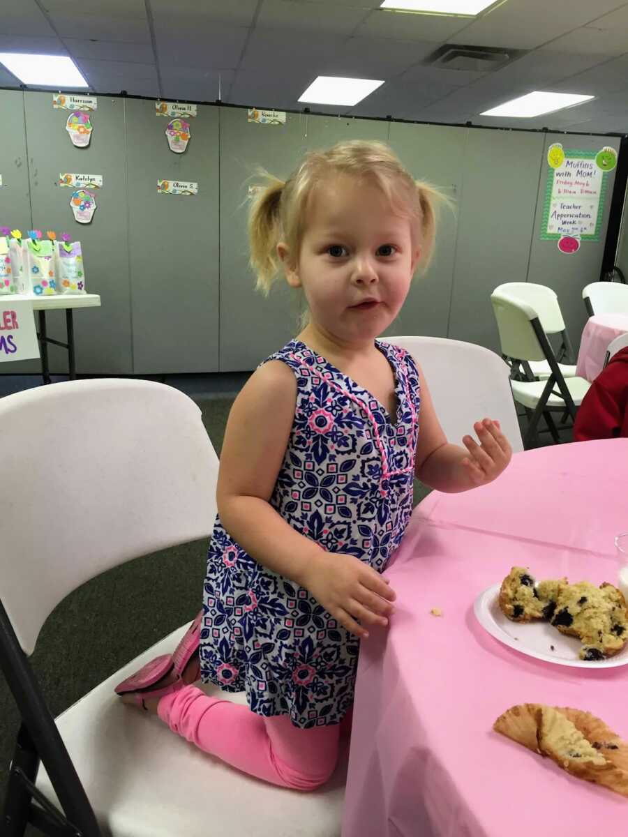 Daughter eating a muffin