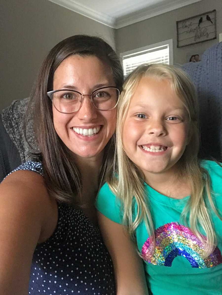 Mother and stepdaughter smiling together