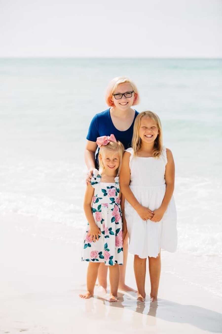 Daughters smiling with their half sister