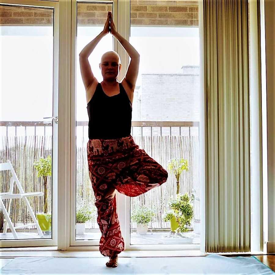 woman with cancer doing yoga