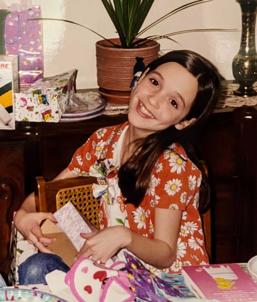 Girl sitting with presents