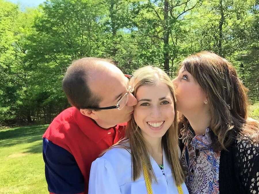 woman with eating disorder wearing a gown and being loved by herparents