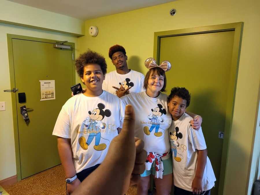 recovering drug addict with her children wearing Disney merchandise