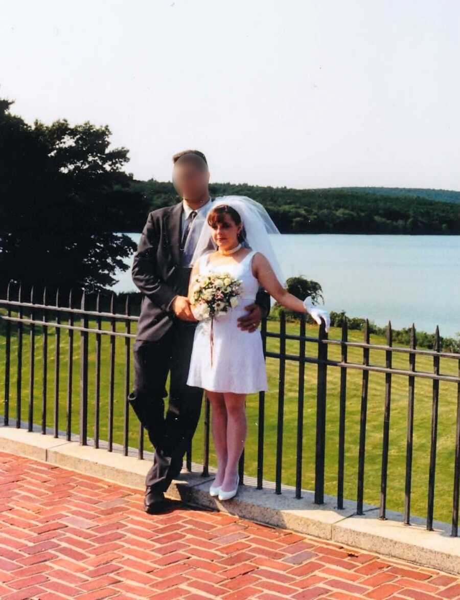 Husband and Wife standing outside at their wedding