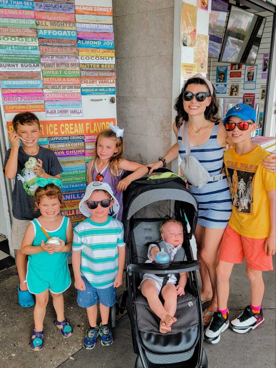 mother and six kids outside of ice cream shop