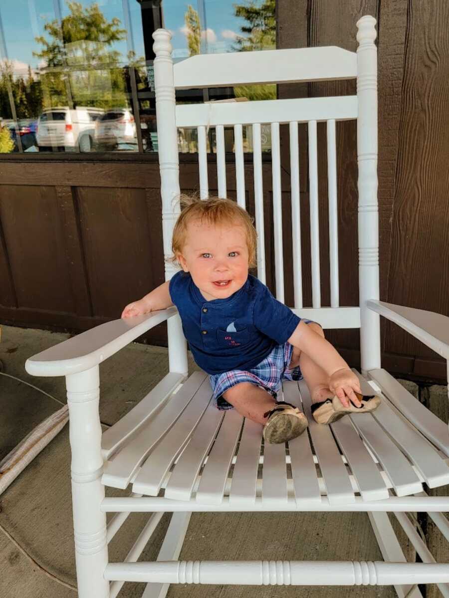 baby sitting on Cracker Barrel rocking chair