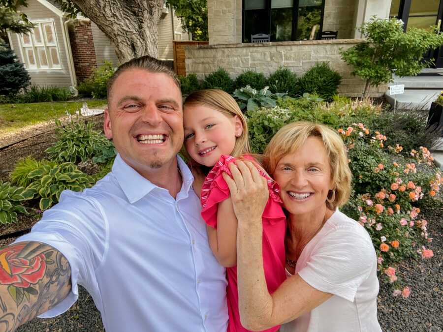 Recovered drug addict with his daughter and mother