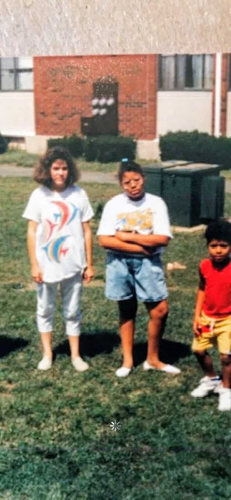 Two girls standing next to each other