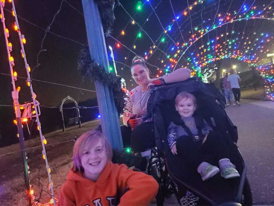 woman in wheelchair with sons 