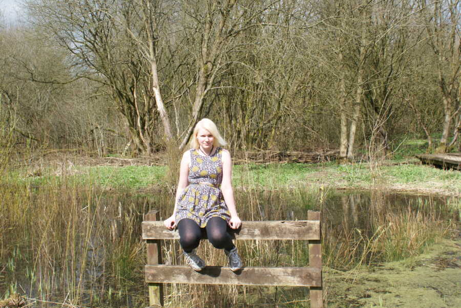 autistic teen sitting on railing