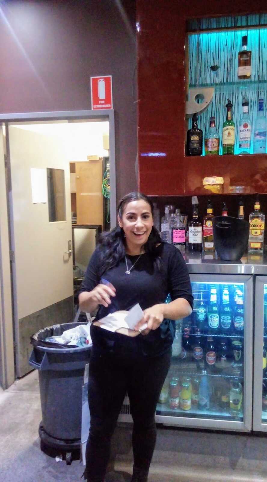 Aboriginal woman working at bar