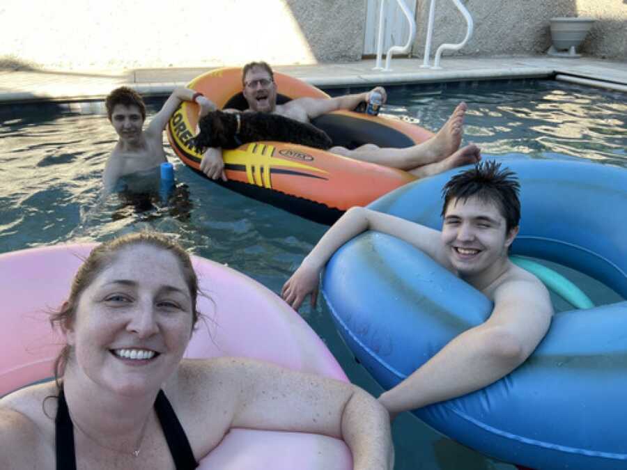 family in the pool together