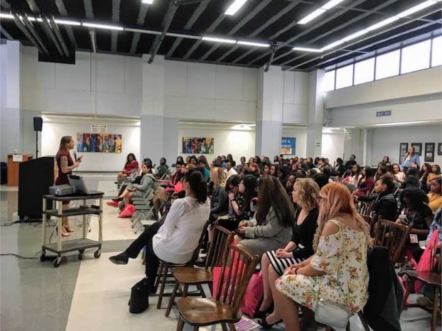 Woman with memory loss speaks to a room of other women