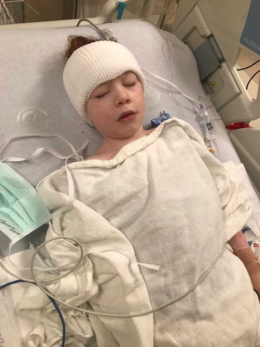 little boy in hospital bed sleeping 