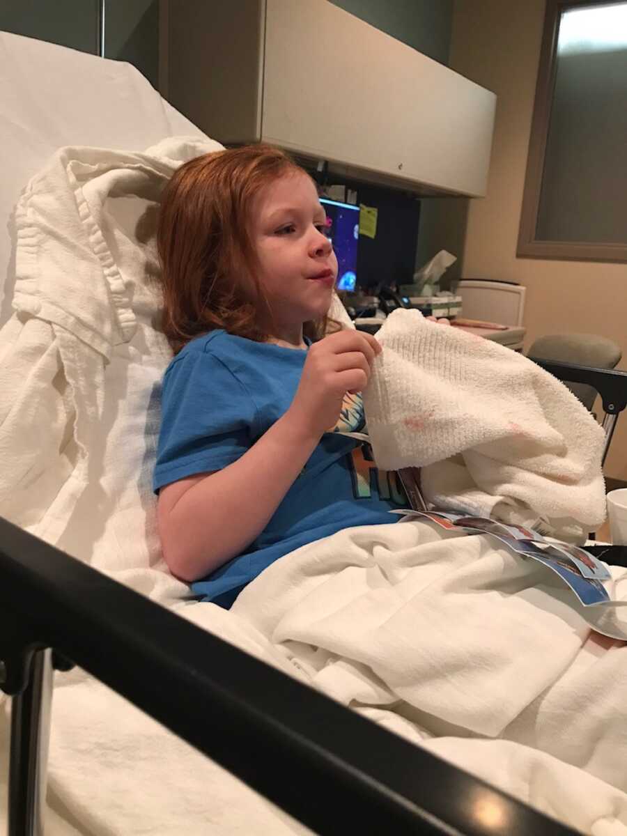 young boy in hospital bed 