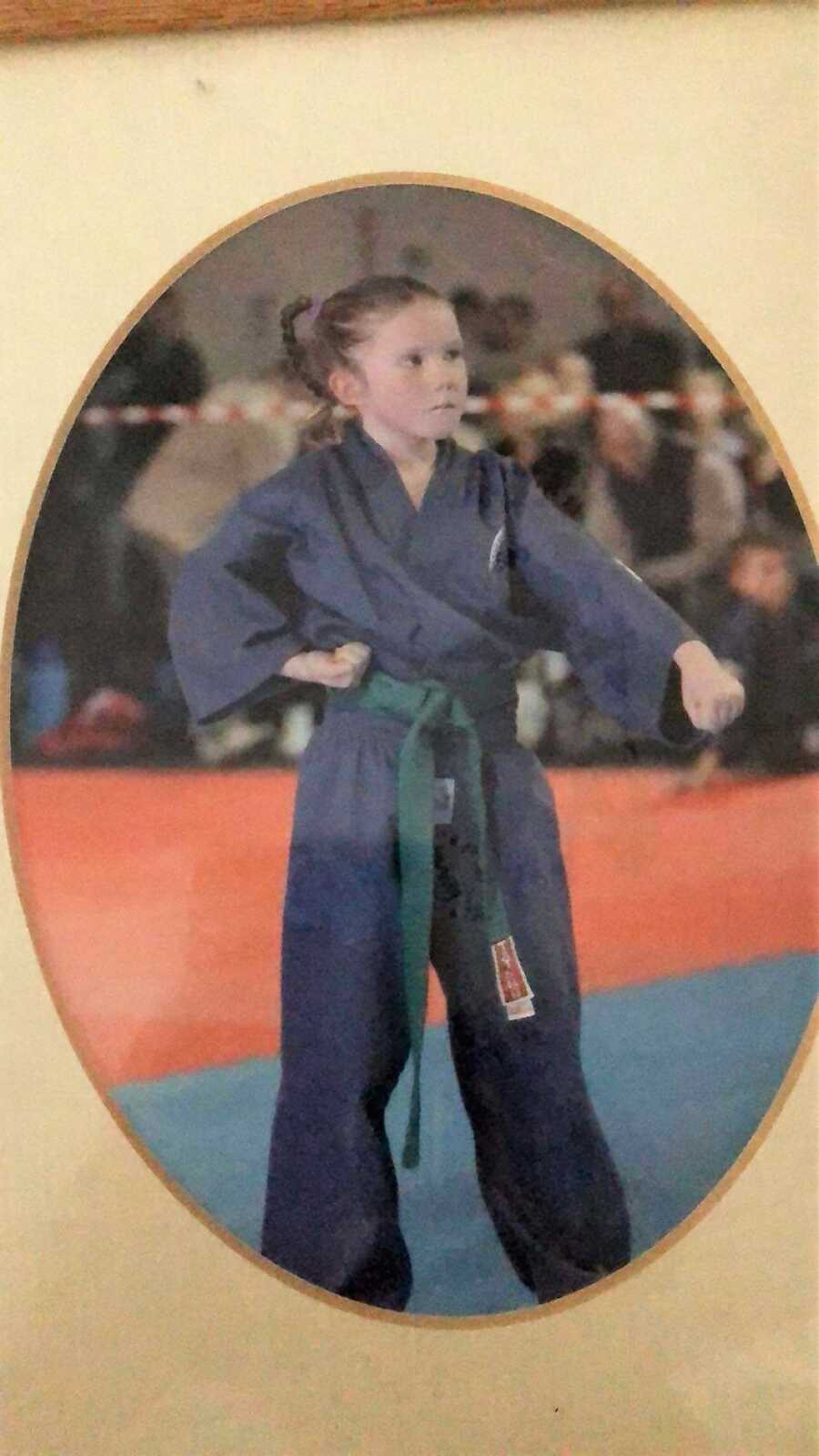little girl doing a karate test