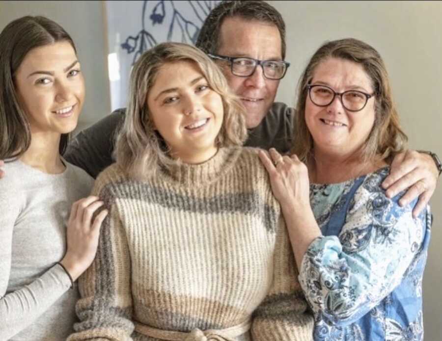 suicide survivor stands with her family members