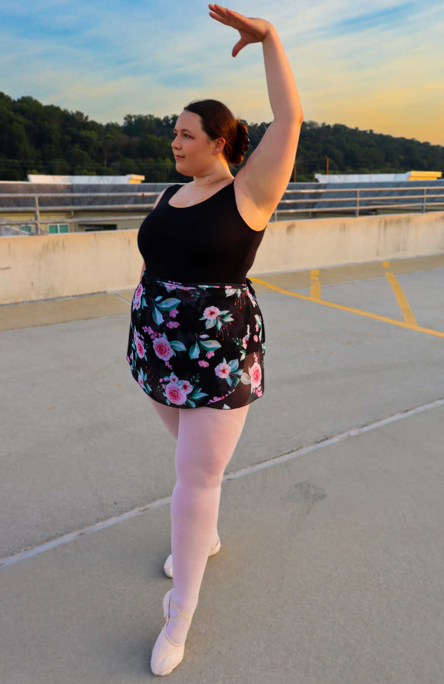 25 year old ballerina poses outside 