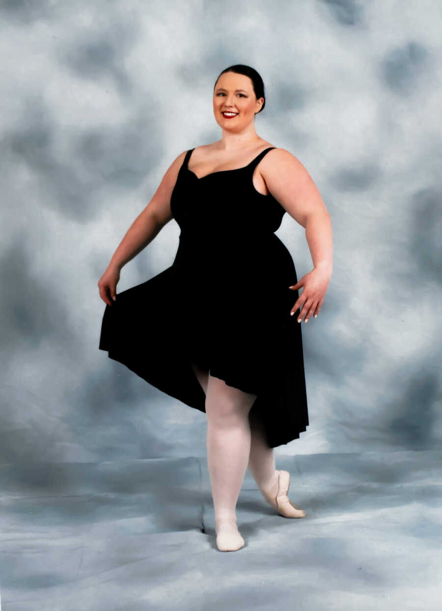 Adult ballerina poses in a studio photo