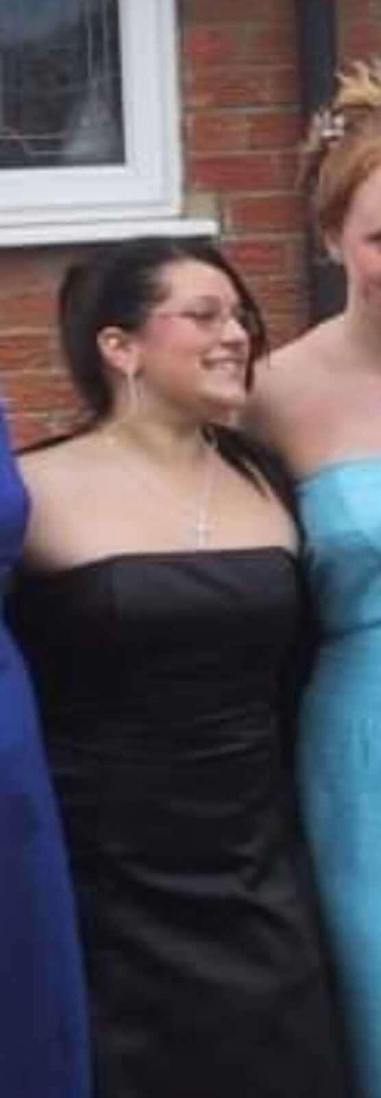 young girl at her prom wearing a black dress