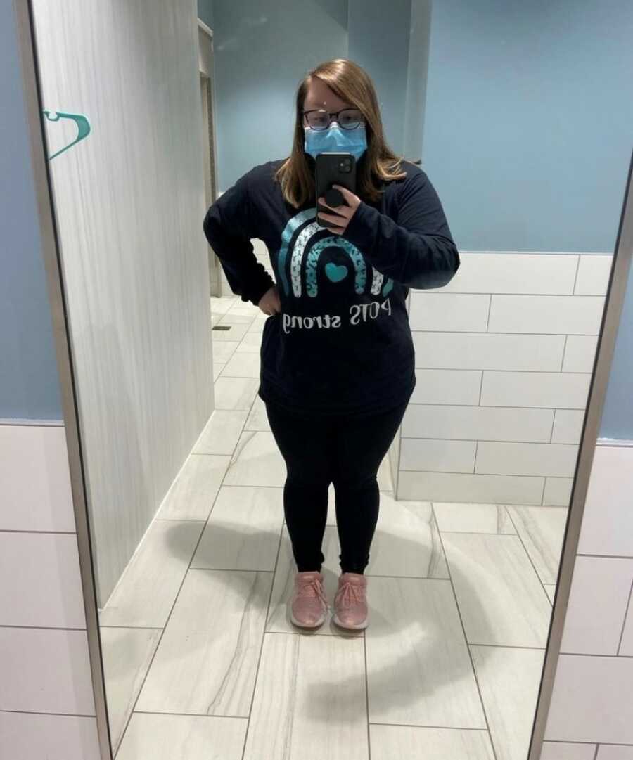woman with chronic illness taking a selfie in the mirror