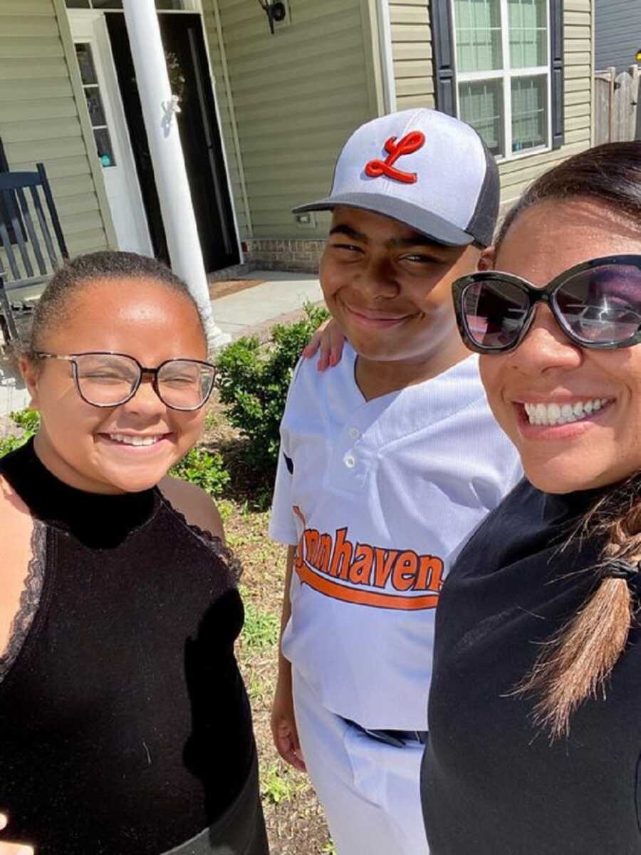 Mom takes selfie with her two kids while her husband is away on deployment.